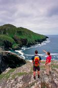 Walkers beneath Mountain Common, Inishturk Island, County Mayo, Ireland. image