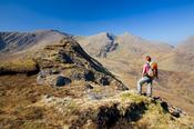 Walker on the ridge to Ben Creggan and Ben Gorm, Co Mayo, Ireland.