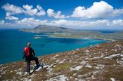 Walker on the Menawn Cliffs, Achill Island, Co Mayo, Ireland.