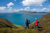 Walkers on the Menawn Cliffs, Achill Island, Co Mayo, Ireland.