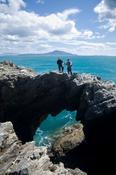 Standing on top of a sea arch, Dooega Head, Achill Island, Co Mayo, Ireland. image