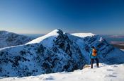 Winter walker near the summit of Mweelrea, Co Mayo, Ireland.