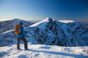 Winter walker near the summit of Mweelrea, Co Mayo, Ireland.