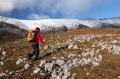 Walker climbing Nephin from the southeast, Co Mayo, Ireland.