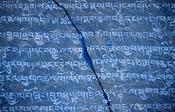 Mani stone carved with buddhist prayers, Annapurna region, Nepal.