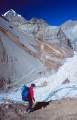 Trekker above Thorong Phedi, Annapurna Circuit, Nepal.