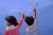 Tharu children with windmills, western Nepal.