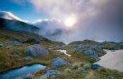 Morning mist over Lake Roe, Fiordland National Park, New Zealand.