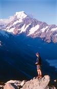Hiker beneath Aoraki / Mt Cook, Mt Cook National Park, New Zealand.