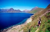 Walkers on the coast path near Elgol, Isle of Skye, Scotland.