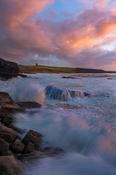 Coastal sunset over Classie Bawn Castle, Mullaghmore, County Sligo, Ireland. image