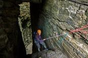 Abseiling into Annach Re Mhor chasm, Kings Mountain, County Sligo, Ireland.