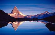 The Matterhorn reflected in the Riffelsee at dawn, Valais, Swiss Alps, Switzerland. image