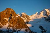 Evening moonrise over Piz Trovat, Berniner Alps, Graubunden, Switzerland.