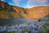 Dawn light illuminates Coumshingaun, Comeragh Mountains, County Waterford, Ireland.