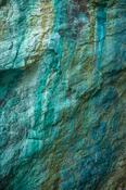 Copper mineral deposits in a cliff face, Copper Coast, County Waterford, Ireland.