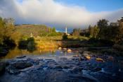 Glendalough round tower and stream, Wicklow Mountains National Park, Co Wicklow, Ireland.