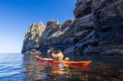 Sea kayaking under The Anvil, Tory Island, County Donegal, Ireland.
