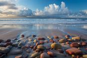 Scattered rocks of old red sandstone on the beach at Mulranny, County Mayo, Ireland.