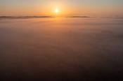 Sunrise over a sea of fog, Clara Bog, County Offaly, Ireland.