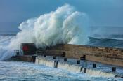Storm waves breaking across Enniscrone Pier, County Sligo, Ireland. image