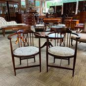 An elegant pair of Edwardian mahogany tub chairs