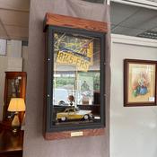 A cased diorama of items relating to New York taxis