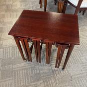 A quality Edwardian-style mahogany nest of four occasional tables.