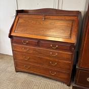 Georgian style mahogany bureau featuring a traditional fall-front writing desk