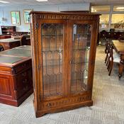 Jaycee oak display cabinet with two leaded glazed doors &amp; a light