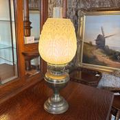 Brass base, embossed milk glass shade with a foliage pattern, antique table lamp image