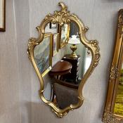 A beautiful Rococo-style decorative wall mirror
