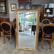 Ornate gilt framed wall mirror image