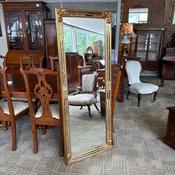 Baroque-inspired gold frame with intricate decorative corner detailing