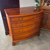 Serpentine chest of four drawers