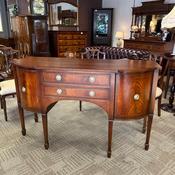 A beautiful breakfront mahogany apron sideboard