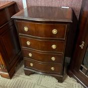 20th century mahogany chest of 4 drawers with serpentine front on bracket feet.