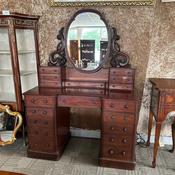 Antique Victorian mahogany pedestal dressing table with an ornate swivel mirror