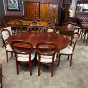 Elegant mahogany extending dining table complete with six matching chairs image