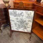 Elegant vintage mahogany fire screen featuring a carved shell &amp; scroll crest image