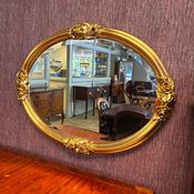 Gilt mirror, Rococo style frame with ornate floral motifs
