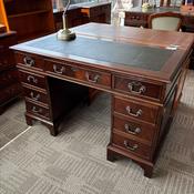 Mahogany flamed green leather top twin pedestal writing desk
