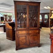 Beautiful traditional two-door display cabinet finished in a rich warm wood tone image