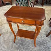Charming mahogany two-tier side table featuring a practical single drawer image