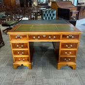 Yew flamed twin pedestal writing desk, olive green top