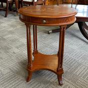 Elegant oval shaped mahogany occasional table with a beautifully inlaid floral image