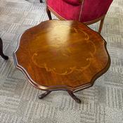 Beautiful mahogany occasional table featuring an elegant shaped top image