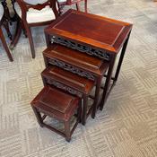 Elegant set of four nesting tables with beautifully hand-carved