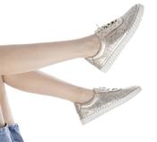 CARMELA gold leather trainers image