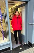 RED JACKET WITH HOOD.PLEAT DETAIL AT THE BACK OF JACKET. image